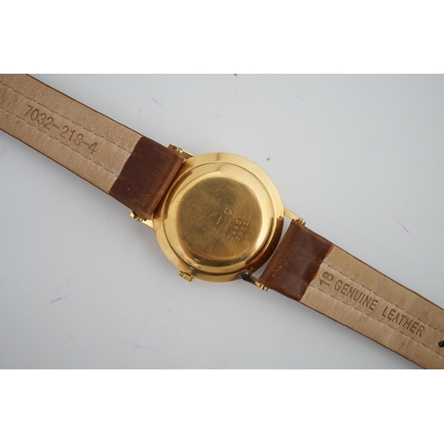 184 - A gentleman's 18k gold Valmon automatic wrist watch, with baton numerals and date aperture, case dia... 