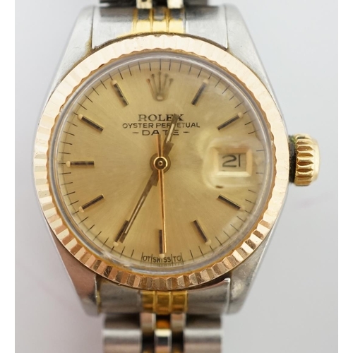 186 - A lady's late 20th century steel and gold Rolex Oyster Perpetual Date wrist watch, with yellow dial ... 