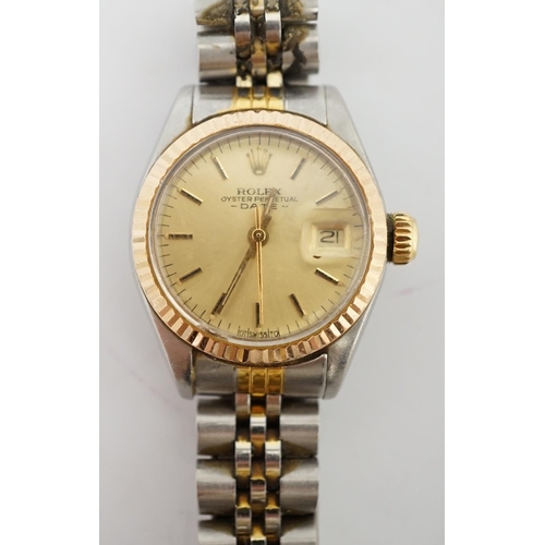 186 - A lady's late 20th century steel and gold Rolex Oyster Perpetual Date wrist watch, with yellow dial ... 