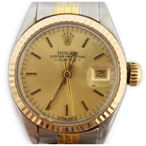 186 - A lady's late 20th century steel and gold Rolex Oyster Perpetual Date wrist watch, with yellow dial ... 