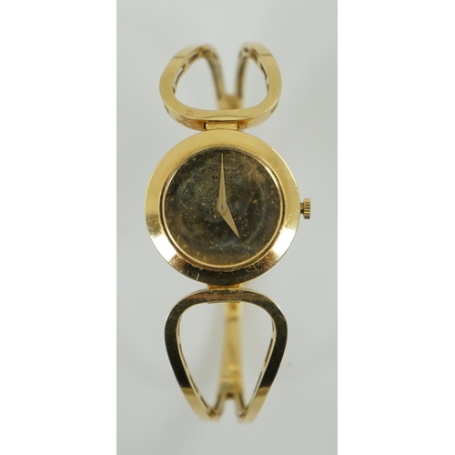 187 - A lady's 18k gold Swiss Chopard manual wind hinged bangle wrist watch, interior diameter 60mm, gross... 