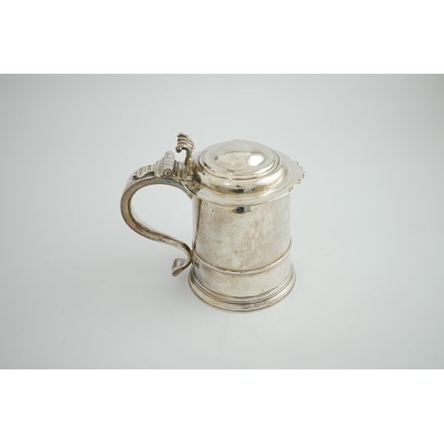 2 - A late Queen Anne Britannia standard silver tankard, maker R?, with banded girdle, hinged domed cove... 