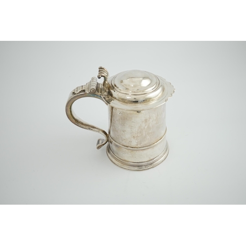 2 - A late Queen Anne Britannia standard silver tankard, maker R?, with banded girdle, hinged domed cove... 