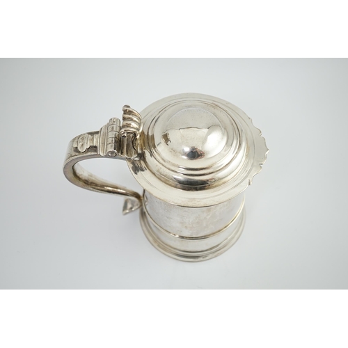 2 - A late Queen Anne Britannia standard silver tankard, maker R?, with banded girdle, hinged domed cove... 