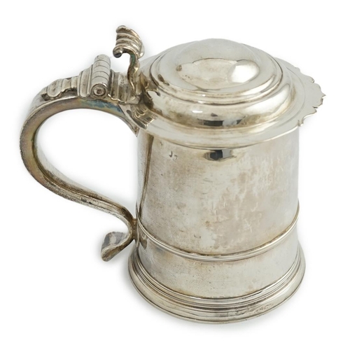 2 - A late Queen Anne Britannia standard silver tankard, maker R?, with banded girdle, hinged domed cove... 