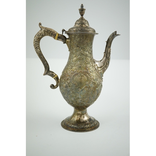 20 - A George III silver pedestal coffee pot, with later embossed decoration, of pyriform, with engraved ... 