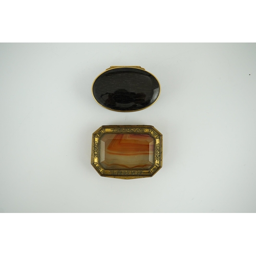 27 - An early 19th century German gold mounted rutile agate? oval snuff box, 64mm and another gilt copper... 