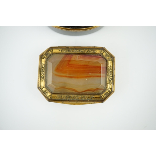 27 - An early 19th century German gold mounted rutile agate? oval snuff box, 64mm and another gilt copper... 