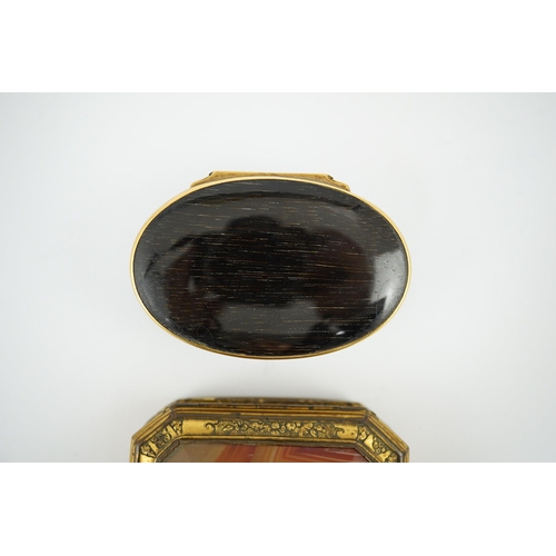 27 - An early 19th century German gold mounted rutile agate? oval snuff box, 64mm and another gilt copper... 