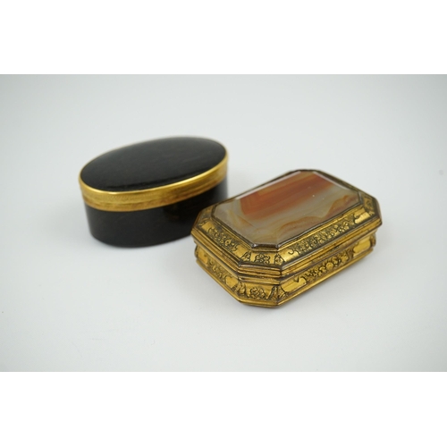 27 - An early 19th century German gold mounted rutile agate? oval snuff box, 64mm and another gilt copper... 