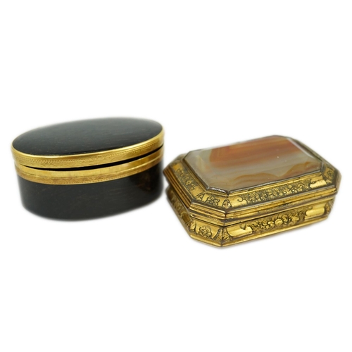 27 - An early 19th century German gold mounted rutile agate? oval snuff box, 64mm and another gilt copper... 