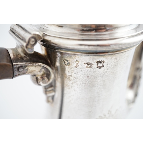 3 - A George II silver coffee pot, by Thomas Whipham, of baluster form, with engraved armorial and monog... 