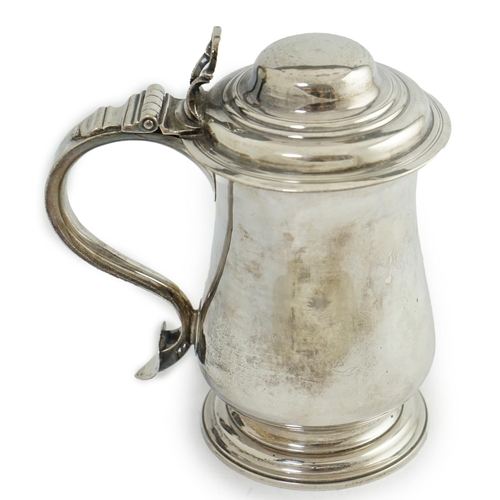 36 - A George III silver tankard, by Charles Wright, of baluster form, with open work thumbpiece, London,... 