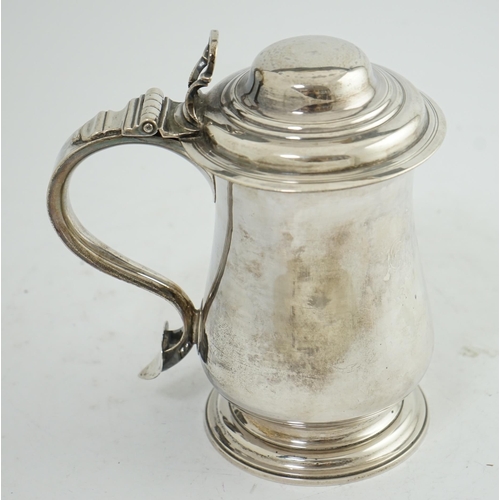 36 - A George III silver tankard, by Charles Wright, of baluster form, with open work thumbpiece, London,... 