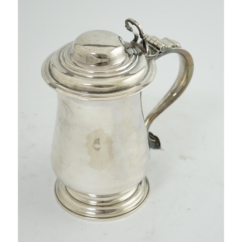 36 - A George III silver tankard, by Charles Wright, of baluster form, with open work thumbpiece, London,... 