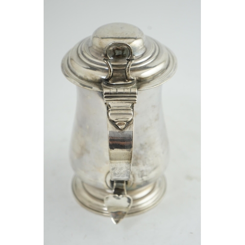 36 - A George III silver tankard, by Charles Wright, of baluster form, with open work thumbpiece, London,... 