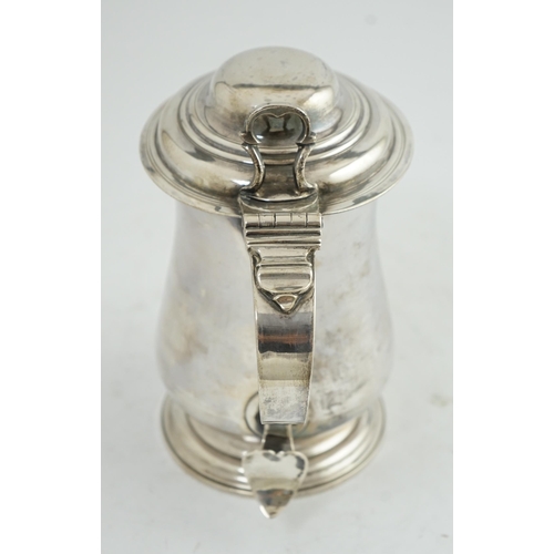 36 - A George III silver tankard, by Charles Wright, of baluster form, with open work thumbpiece, London,... 