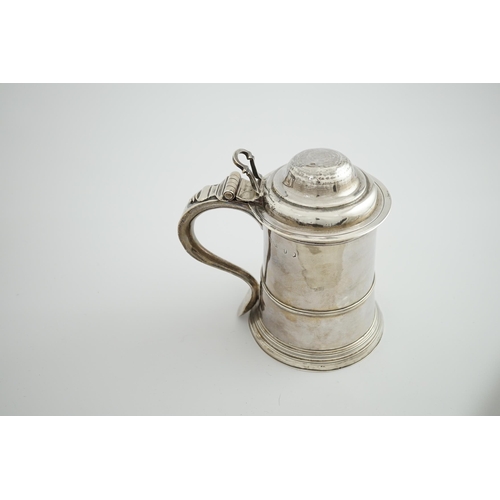 4 - A George II silver tankard, indistinct maker's mark, with banded girdle, hinged domed cover and open... 