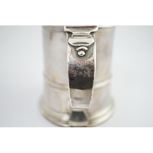 4 - A George II silver tankard, indistinct maker's mark, with banded girdle, hinged domed cover and open... 