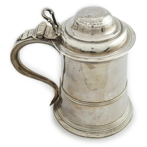 4 - A George II silver tankard, indistinct maker's mark, with banded girdle, hinged domed cover and open... 