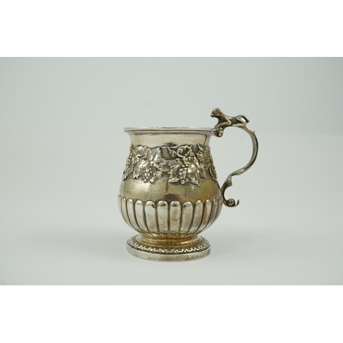 42 - A George IV demi-fluted silver christening cup, by Eames & Barnard, of baluster form, with band of f... 