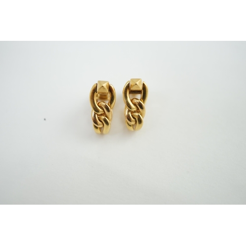 472 - A pair of 18K yellow gold stirrup cufflinks, by Boucheron, (signed and numbered 26504), of twisted c... 