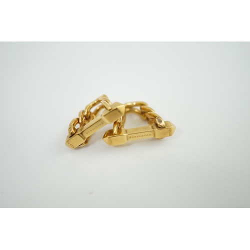 472 - A pair of 18K yellow gold stirrup cufflinks, by Boucheron, (signed and numbered 26504), of twisted c... 