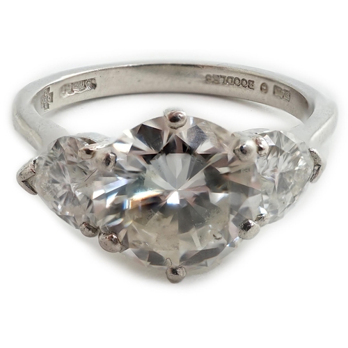 473 - A modern platinum and single stone diamond ring, with two stone heart shaped diamond set shoulders, ... 