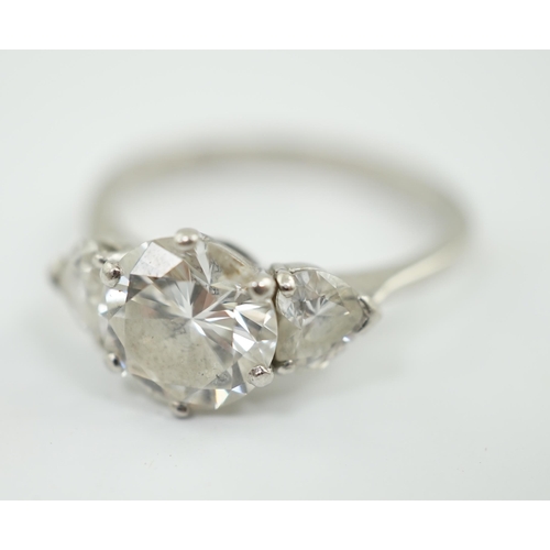 473 - A modern platinum and single stone diamond ring, with two stone heart shaped diamond set shoulders, ... 