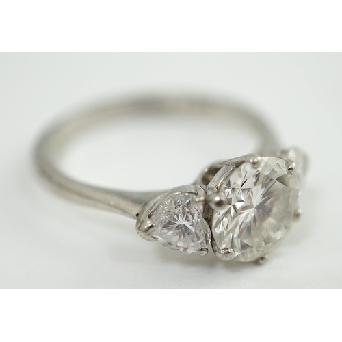 473 - A modern platinum and single stone diamond ring, with two stone heart shaped diamond set shoulders, ... 