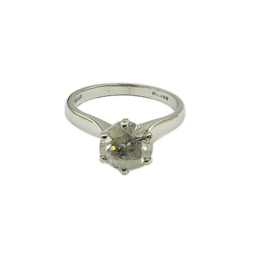 478 - A modern 18ct white gold and solitaire diamond set ring, the stone of cloudy appearance, with a diam... 