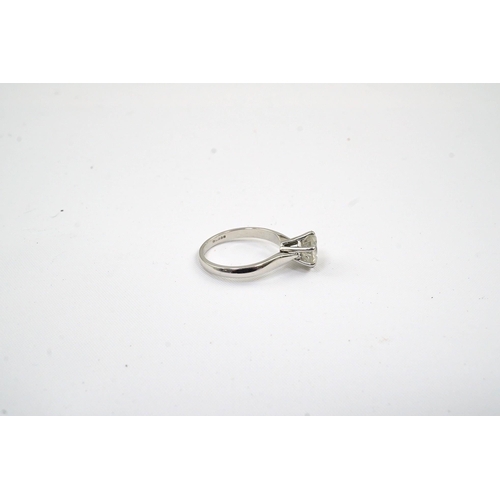 478 - A modern 18ct white gold and solitaire diamond set ring, the stone of cloudy appearance, with a diam... 