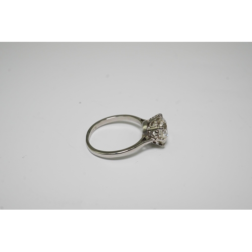 480 - A platinum and solitaire diamond set ring, the round cut stone weighing approximately 2.40ct, with a... 