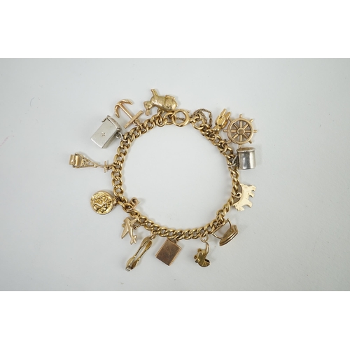 482 - A 18ct gold charm bracelet, hung with fourteen assorted 9ct gold or silver charms, including a pram,... 