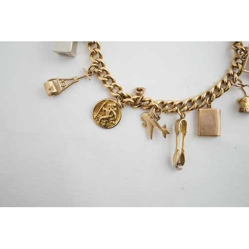 482 - A 18ct gold charm bracelet, hung with fourteen assorted 9ct gold or silver charms, including a pram,... 