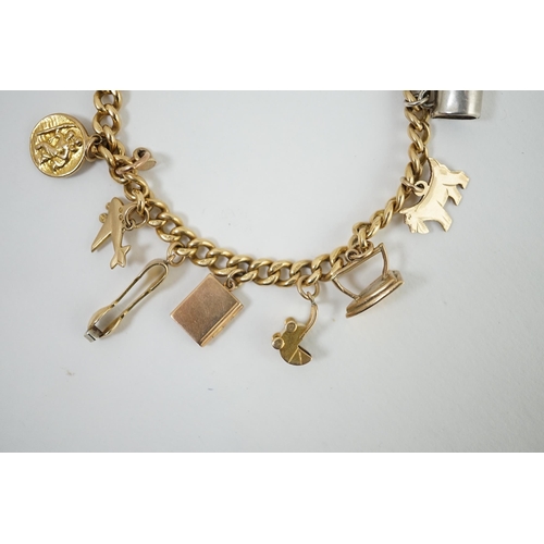 482 - A 18ct gold charm bracelet, hung with fourteen assorted 9ct gold or silver charms, including a pram,... 