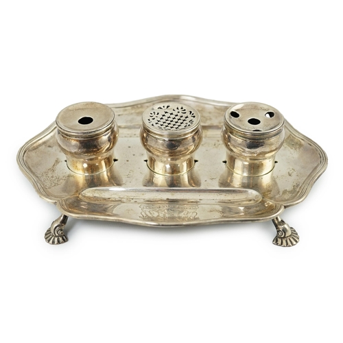 5 - A George II silver inkstand, William Cripps, 1750, the cartouche shaped stand with reeded border, on... 