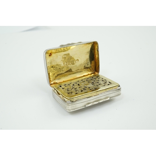 56 - An early George IV silver rectangular vinaigrette, by Simpson & Son, decorated with a basket of foli... 