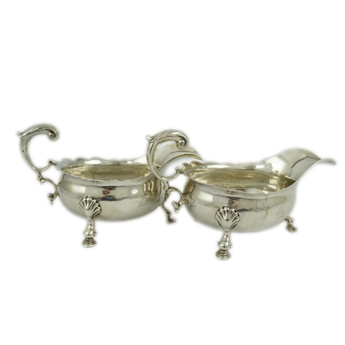 6 - A pair of George II silver sauceboats, by Henry Brind, with flying scroll handles, engraved armorial... 