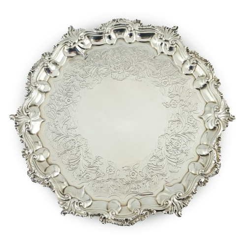 60 - A George IV silver salver, by William Bateman, of shaped circular form, with scroll and foliate bord... 