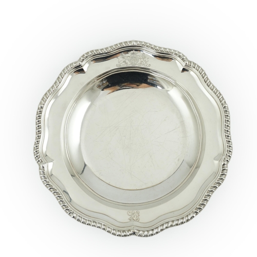 61 - A George IV silver soup plate, by William Eaton, of shaped circular form, with engraved initials and... 