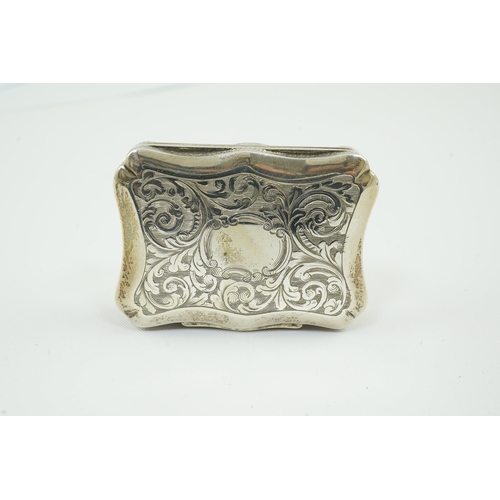 67 - An early Victorian engraved silver vinaigrette, by William Simpson, of shaped rectangular form and d... 