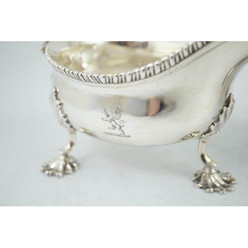 7 - A pair of George III silver sauceboats, by Thomas Evans, with flying scroll handles and engraved arm... 