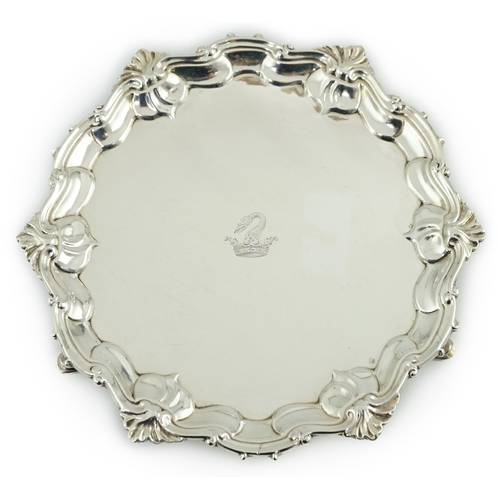 8 - A George II silver waiter, by Samuel Courtauld, of shaped circular form, with shell and scroll borde... 