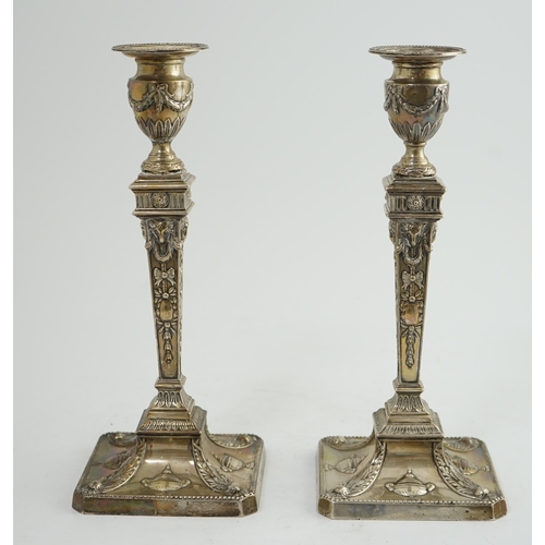 91 - A pair of late Victorian silver Adams style candlesticks, by William Hutton & Sons, with ram's head ... 