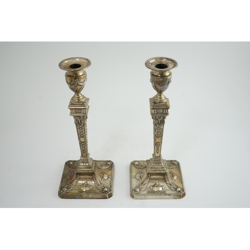 91 - A pair of late Victorian silver Adams style candlesticks, by William Hutton & Sons, with ram's head ... 