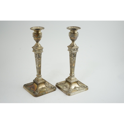 91 - A pair of late Victorian silver Adams style candlesticks, by William Hutton & Sons, with ram's head ... 