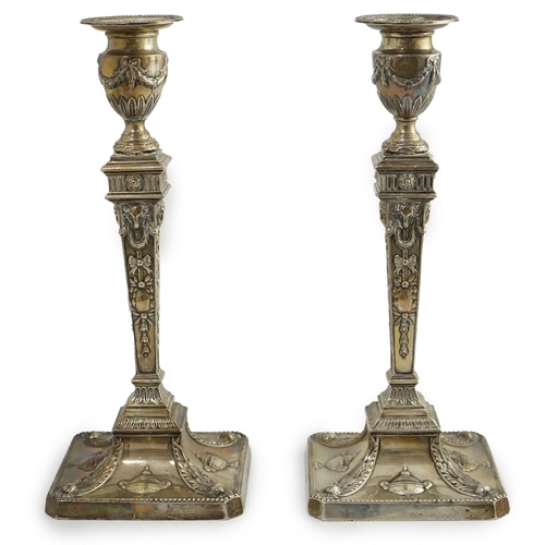 91 - A pair of late Victorian silver Adams style candlesticks, by William Hutton & Sons, with ram's head ... 