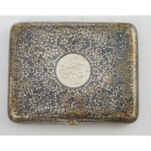 96 - A late 19th century Russian 84 zolotnik silver and niello cigarette case, decorated with scrolls and... 