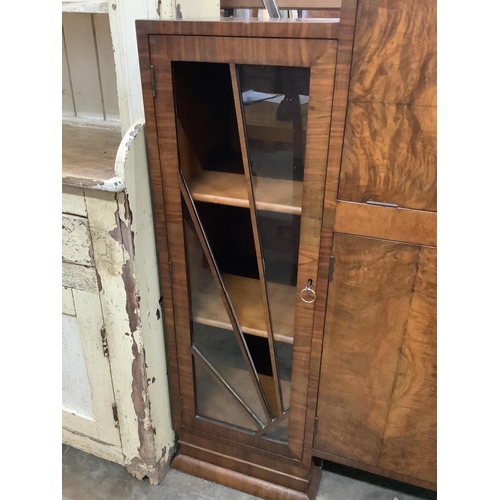 1001 - An Art Deco figured walnut cocktail cabinet, width 136cm, depth 39cm, height 123cm. Condition - one ... 